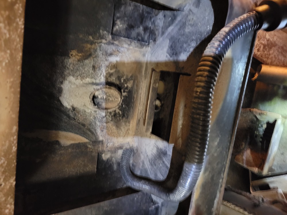 You can buy a Keyboard vacuum hose for around $10. Or make one up from a flexable hose. I had this around from a previous ash vacuum "accessory kit". Perfect to get around the back of that metal plate that gets full of ash when hooked up to a ash vacuum.
