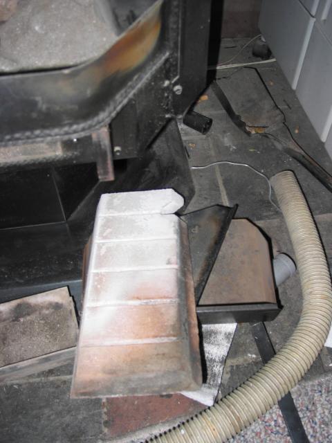 Click to see the firebrick and metal holder (note the notch).
